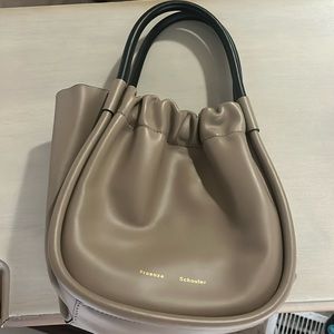 Proezna Schouler handbag with adjustable strap.